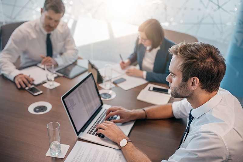 Business manager has team meeting in conference room