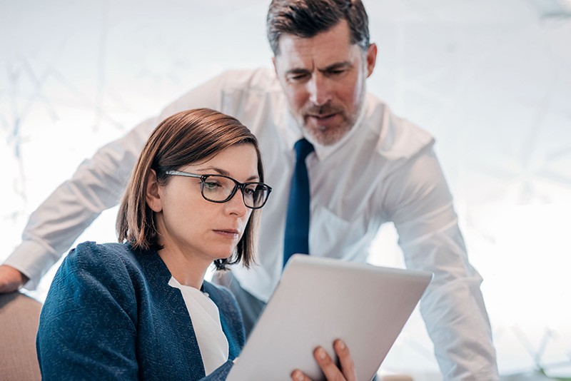 Monitor, track and report IT expenditures Manager looks over employees shoulder to assist in project development