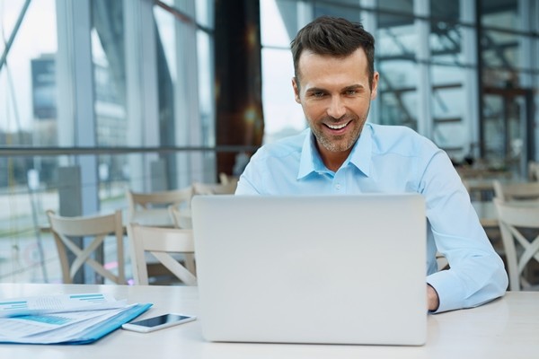 Businessman analyzes updates through real time reporting 