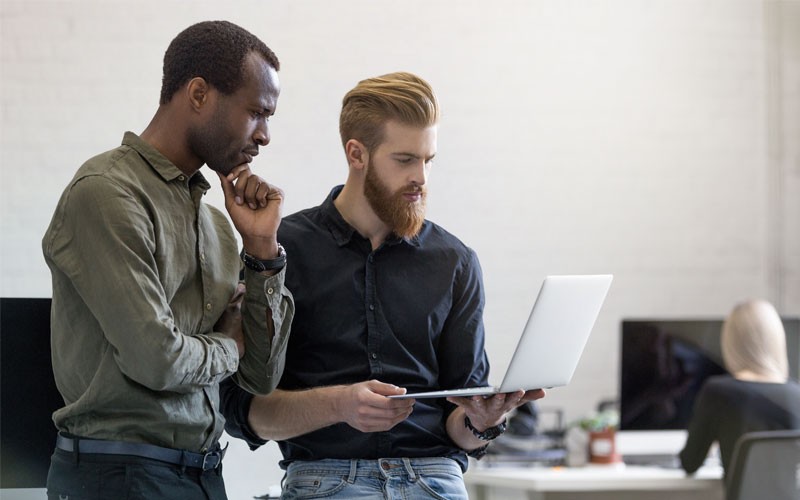 Business professional on laptop with support